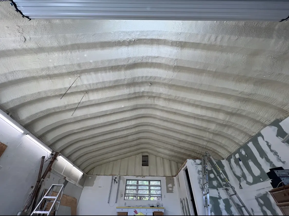 Spray polyurethane foam applied to the underside of a metal roof deck in Kinnelon